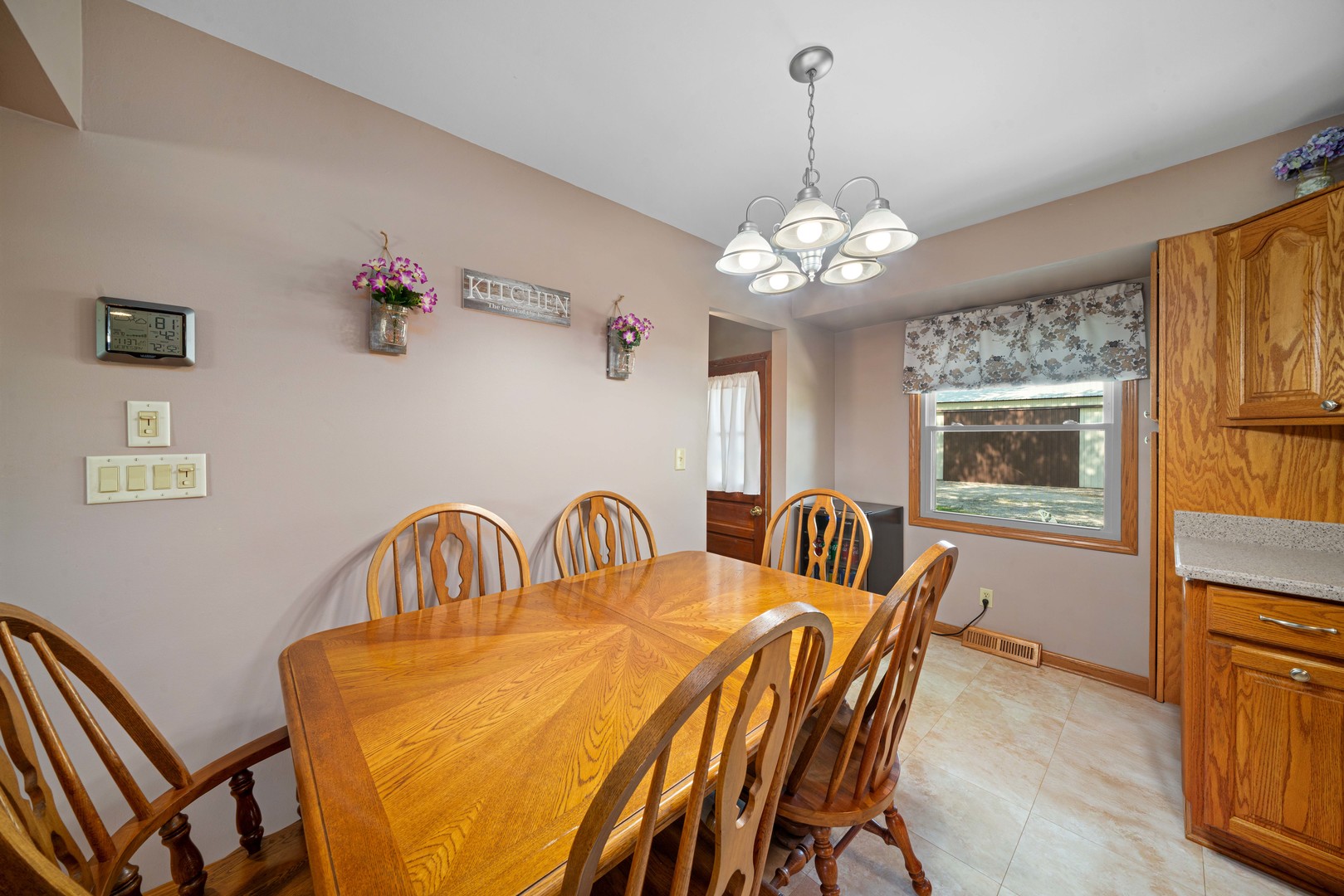 14893 Plank Road Sycamore, IL 60178 - Photo 15 of 33 a view of a dining room with furniture and chandelier