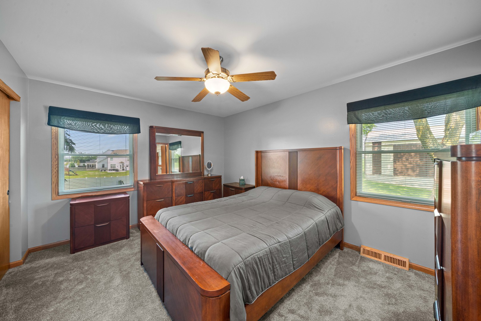 14893 Plank Road Sycamore, IL 60178 - Photo 19 of 33 a spacious bedroom with a large bed and a chandelier