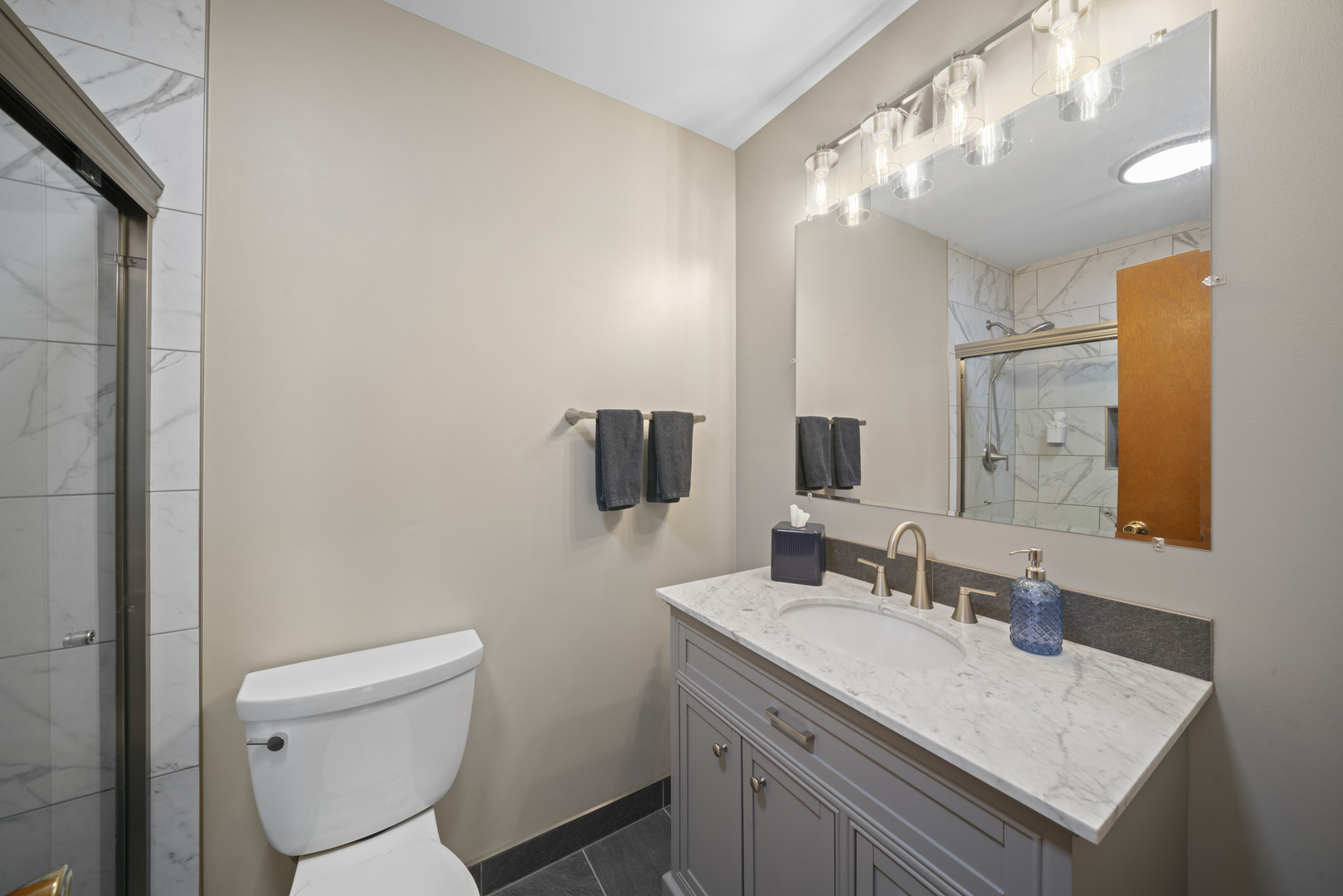 14893 Plank Road Sycamore, IL 60178 - Photo 23 of 33 a bathroom with a granite countertop sink toilet and mirror
