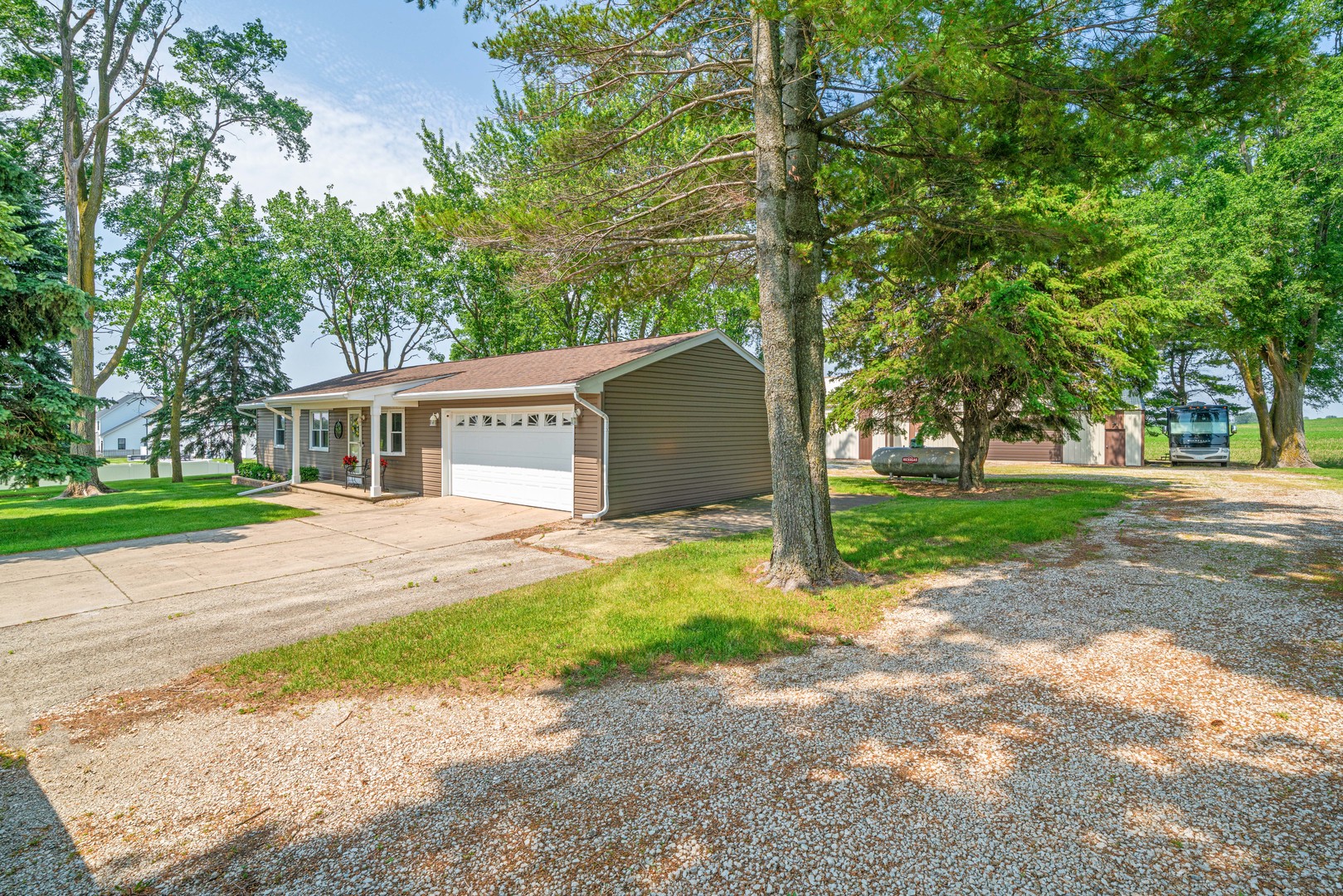14893 Plank Road Sycamore, IL 60178 - Photo 3 of 33 a view of a house with a yard and large trees