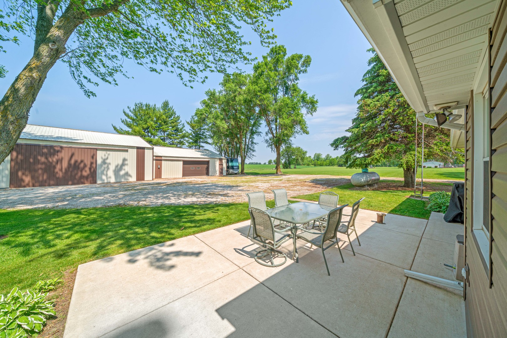 14893 Plank Road Sycamore, IL 60178 - Photo 4 of 33 a view of backyard with swimming pool and patio