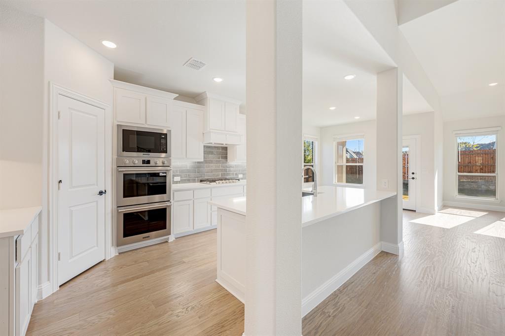 2505 Rileigh Lane Mansfield, TX 76063 - Photo 11 of 40 a view of a kitchen with microwave and cabinets