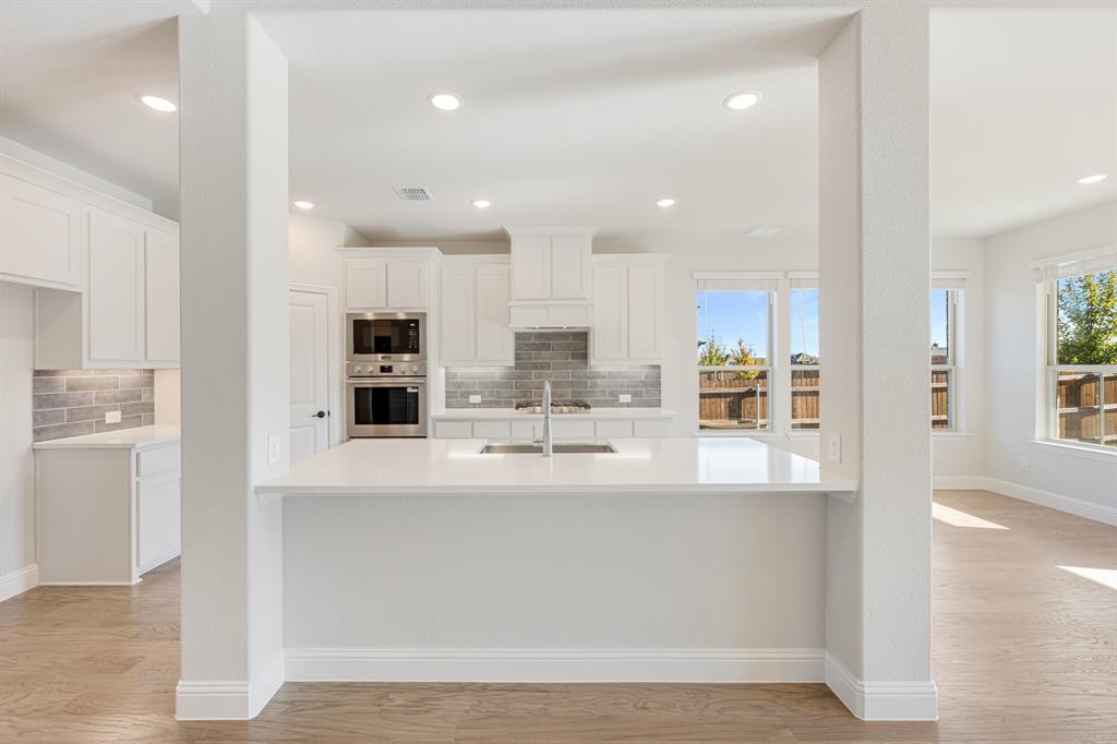 2505 Rileigh Lane Mansfield, TX 76063 - Photo 12 of 40 a view of large kitchen with stainless steel appliances sink refrigerator and cabinets