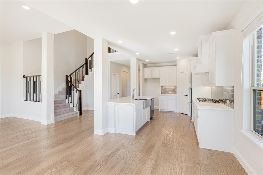 2505 Rileigh Lane Mansfield, TX 76063 - Photo 16 of 40 a view of a kitchen with wooden floor and electronic appliances