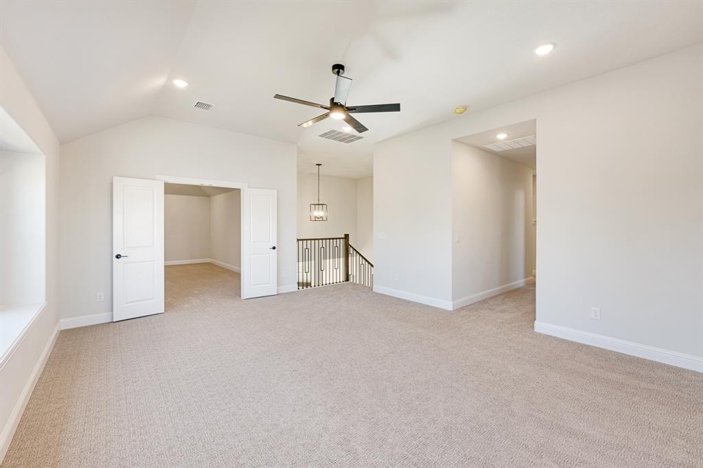 2505 Rileigh Lane Mansfield, TX 76063 - Photo 29 of 40 wooden floor in an empty room with a ceiling fan