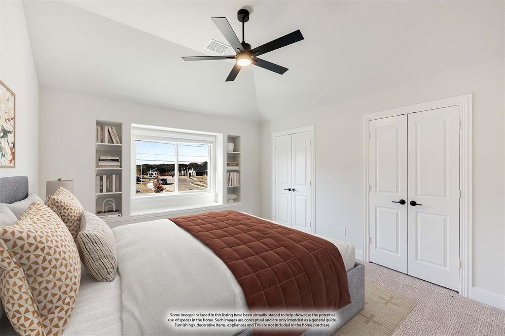2505 Rileigh Lane Mansfield, TX 76063 - Photo 33 of 40 a bedroom with a large bed and a large window