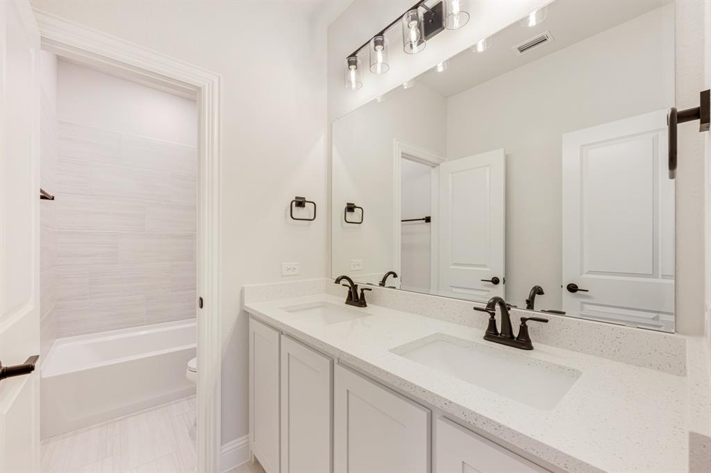 2505 Rileigh Lane Mansfield, TX 76063 - Photo 34 of 40 a bathroom with a sink and a mirror