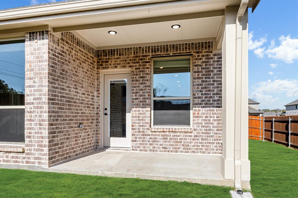 2505 Rileigh Lane Mansfield, TX 76063 - Photo 37 of 40 a front view of a house with a yard