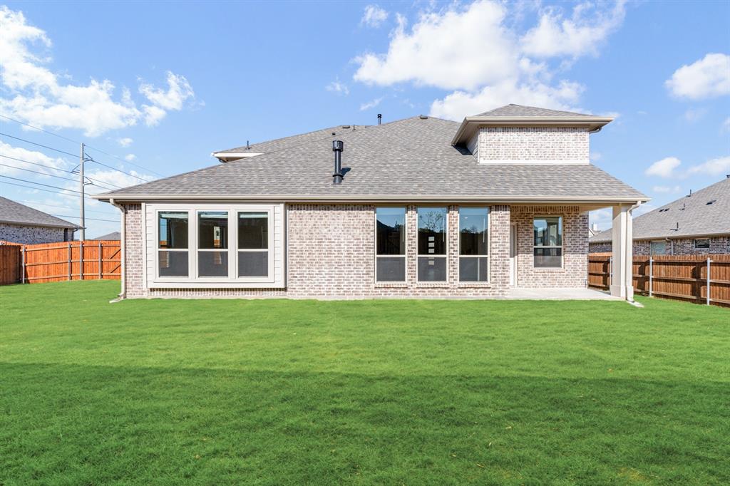 2505 Rileigh Lane Mansfield, TX 76063 - Photo 39 of 40 a front view of a house with a garden