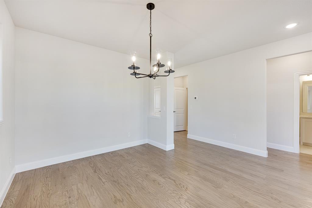2505 Rileigh Lane Mansfield, TX 76063 - Photo 6 of 40 a view of a chandelier in big room and empty room