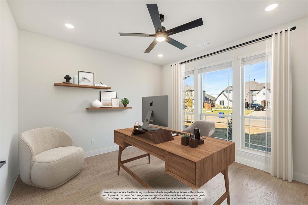 2505 Rileigh Lane Mansfield, TX 76063 - Photo 8 of 40 a living room with a couch and a table