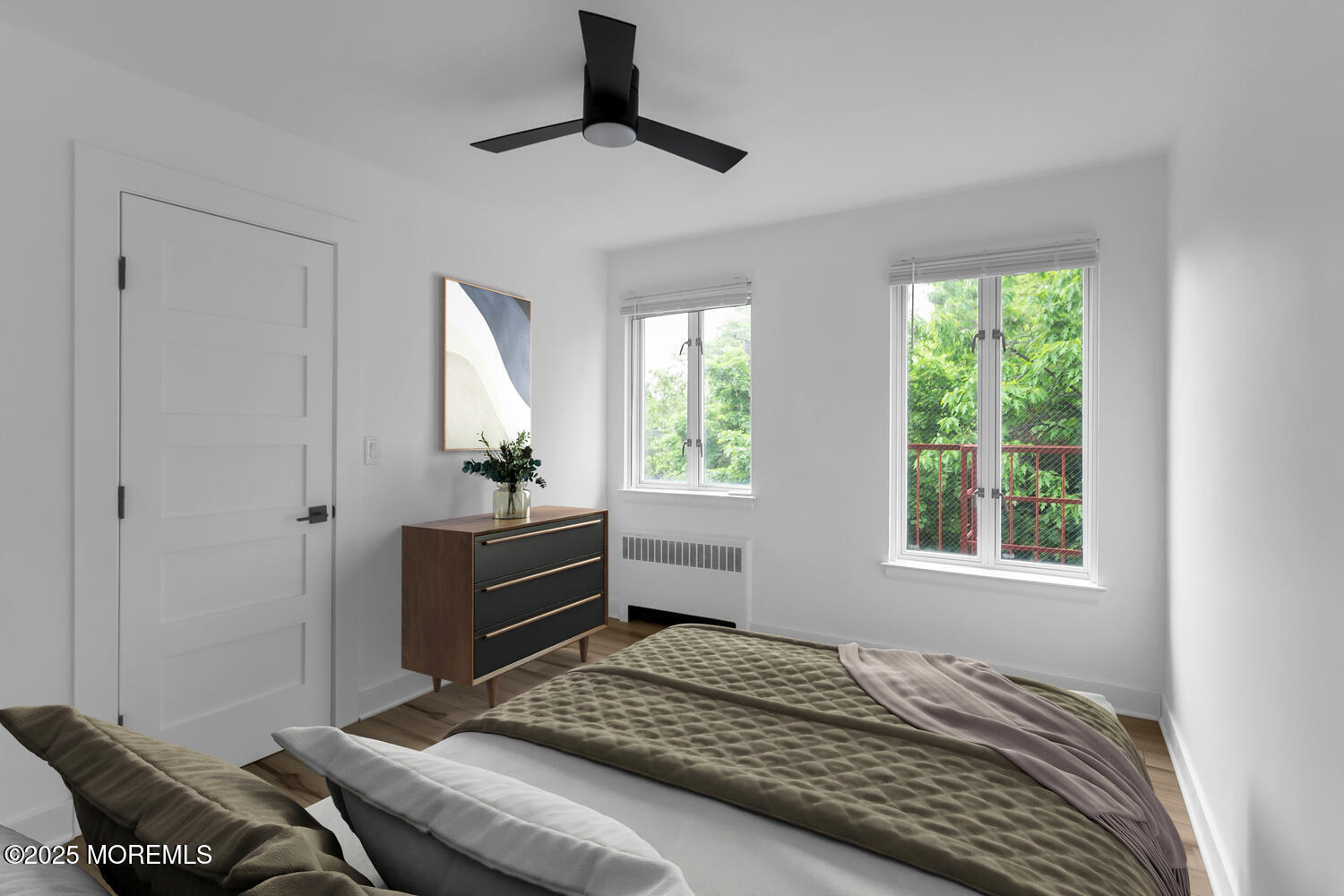 283 Spring Street, Unit 3C Red Bank, NJ 07701 - Photo 11 of 26 a bedroom with a bed and a window
