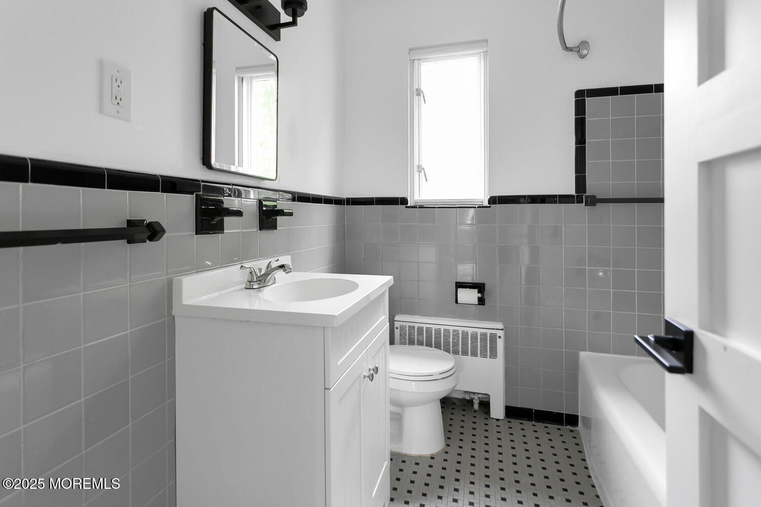 283 Spring Street, Unit 3C Red Bank, NJ 07701 - Photo 13 of 26 a bathroom with a sink a toilet and a mirror