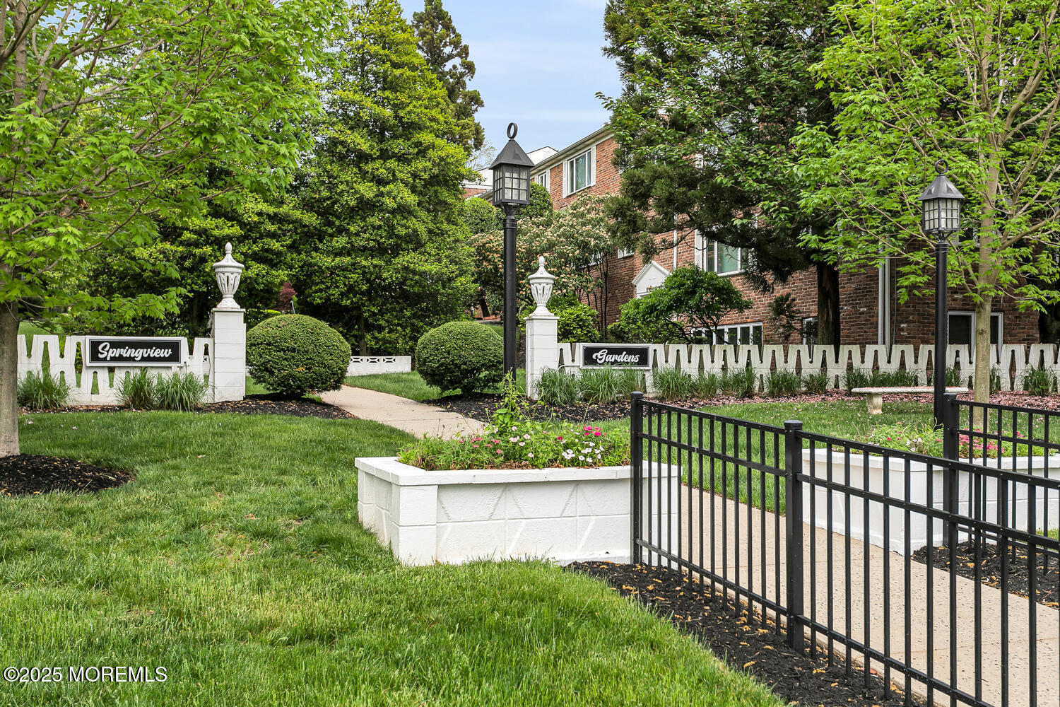 283 Spring Street, Unit 3C Red Bank, NJ 07701 - Photo 19 of 26 a view of a garden and deck