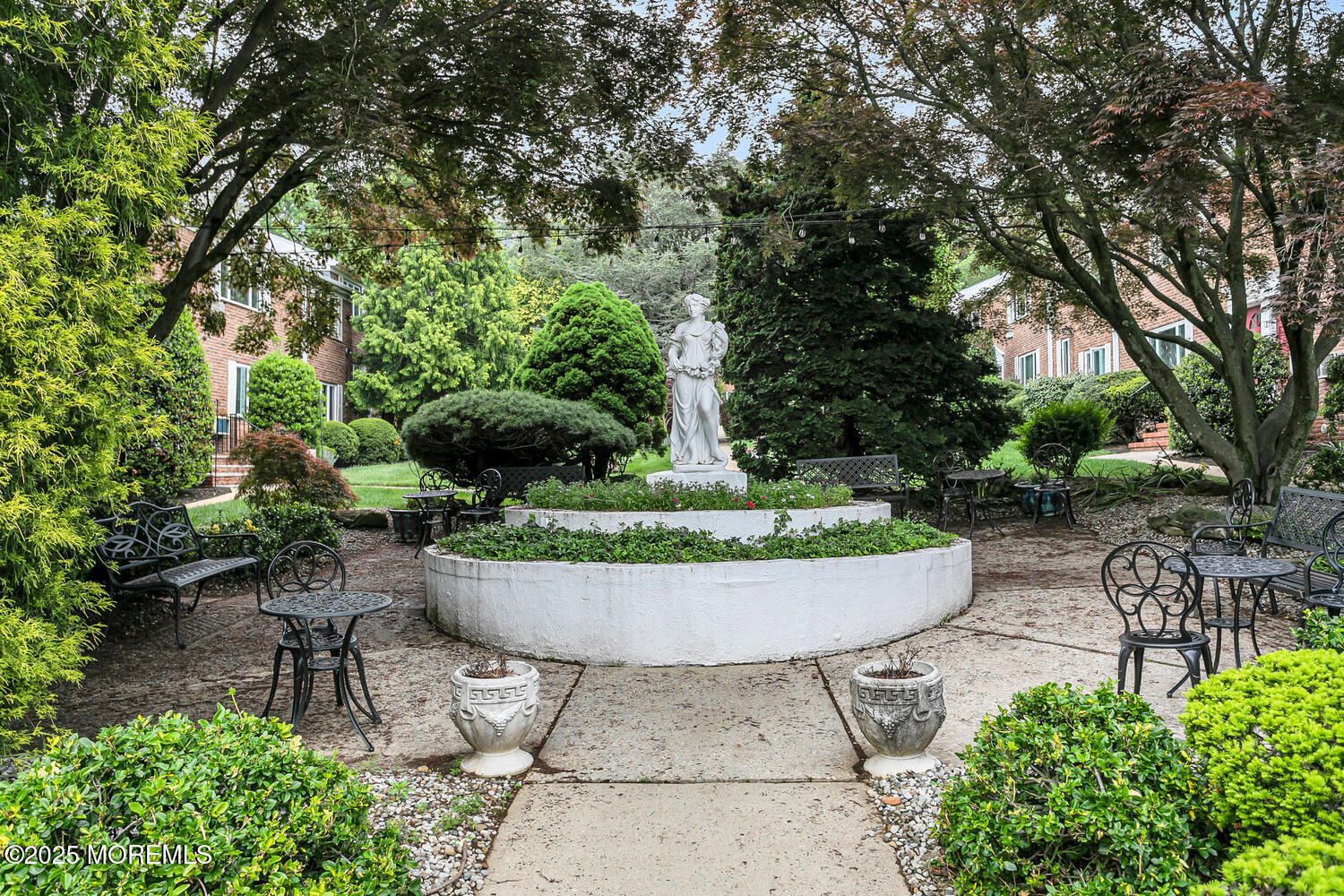 283 Spring Street, Unit 3C Red Bank, NJ 07701 - Photo 2 of 26 a view of a backyard with sitting area