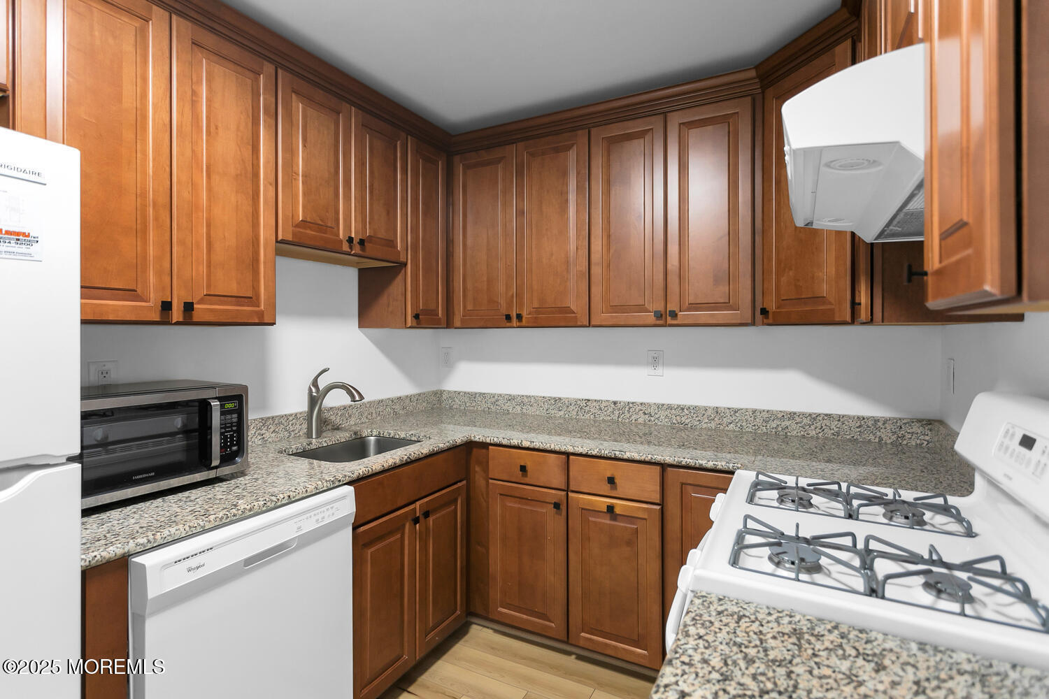 283 Spring Street, Unit 3C Red Bank, NJ 07701 - Photo 8 of 26 a kitchen with stainless steel appliances granite countertop a sink stove and cabinets
