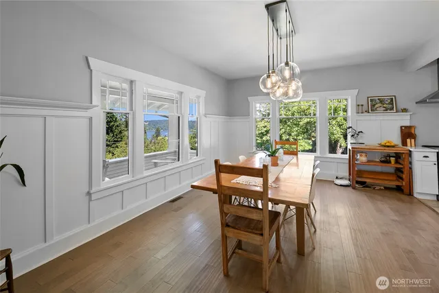 a large kitchen with a table and chairs