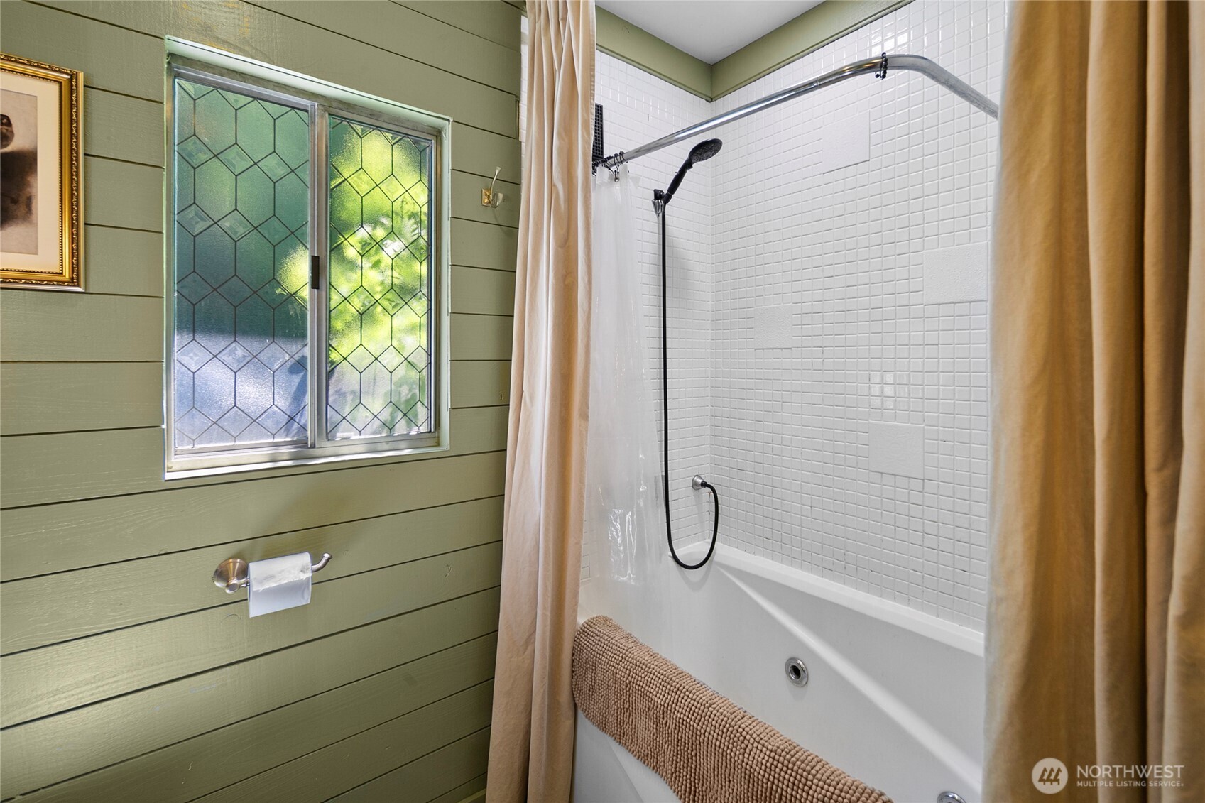 16832 McIntyre Road Southwest Vashon, WA 98070 - Photo 17 of 38 a bathroom with a shower and a bathtub