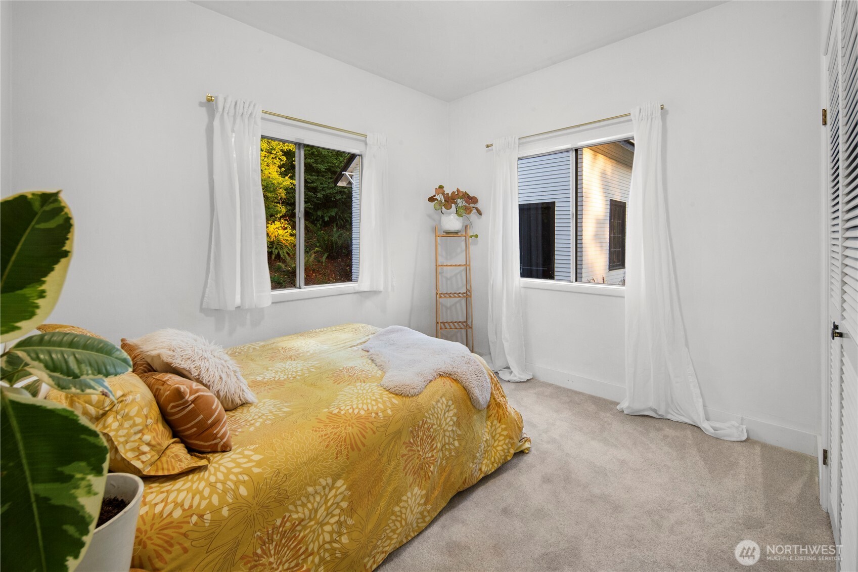 16832 McIntyre Road Southwest Vashon, WA 98070 - Photo 18 of 38 a bedroom with a bed and a window