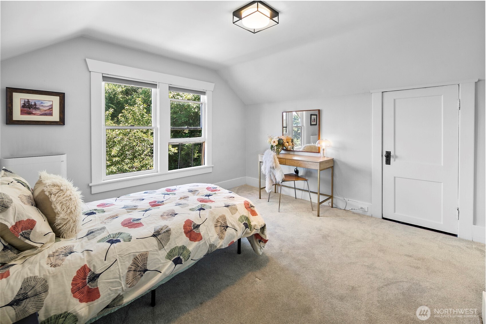 16832 McIntyre Road Southwest Vashon, WA 98070 - Photo 25 of 38 a bedroom with a bed and a table