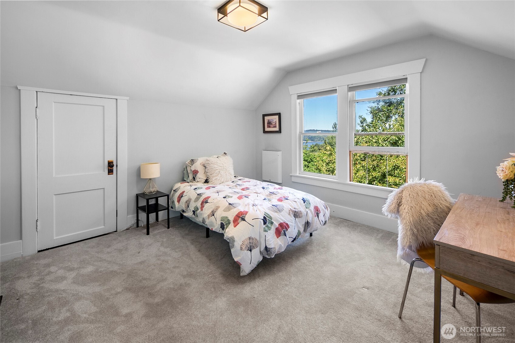 16832 McIntyre Road Southwest Vashon, WA 98070 - Photo 26 of 38 a bedroom with a bed and a window