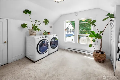 a view of a house with a tree