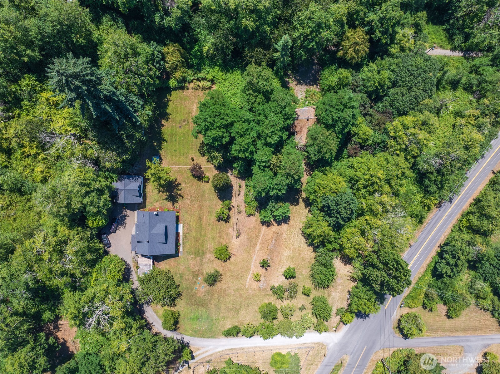 16832 McIntyre Road Southwest Vashon, WA 98070 - Photo 36 of 38 an aerial view of residential house with outdoor space and trees all around
