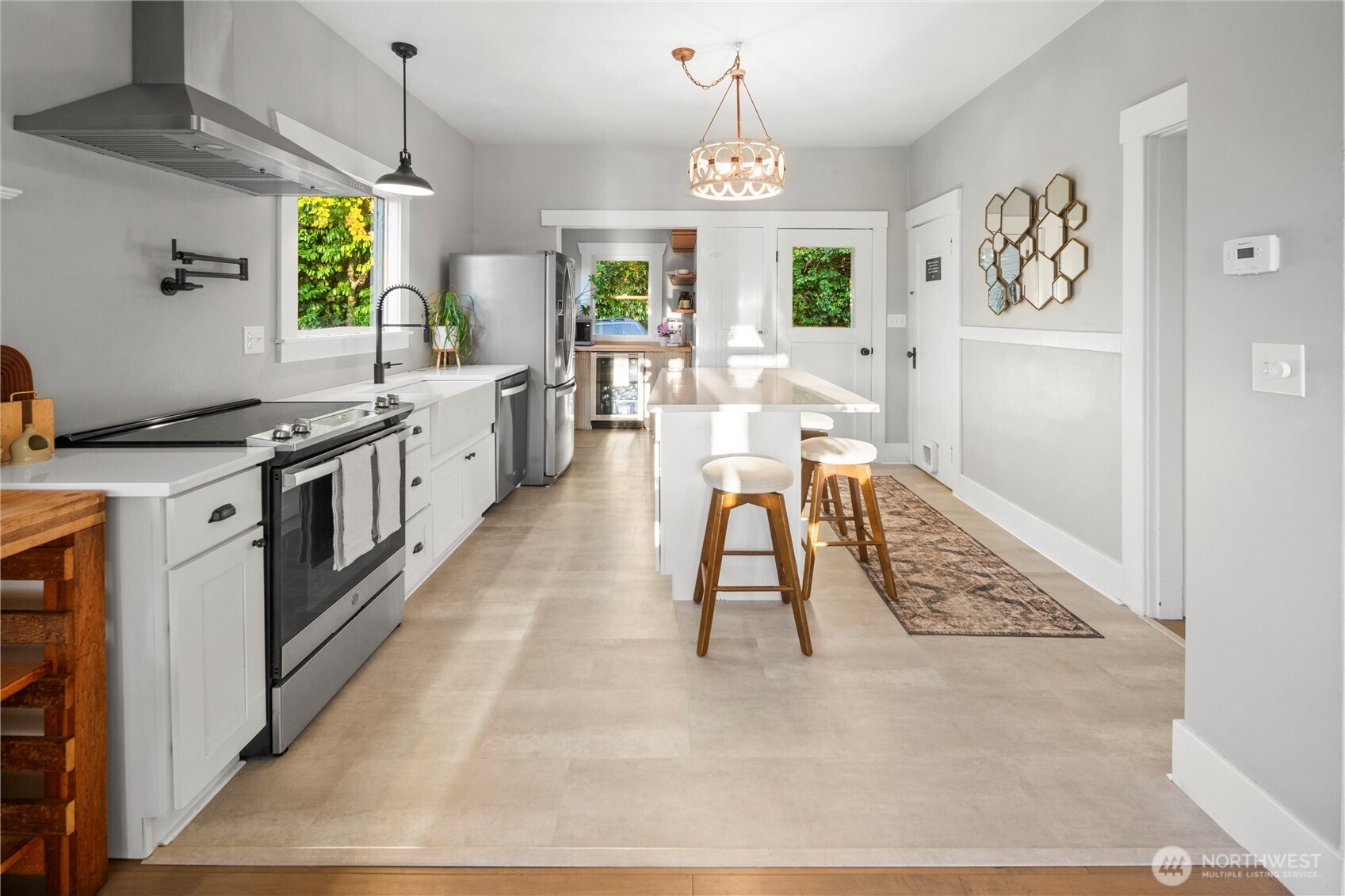 16832 McIntyre Road Southwest Vashon, WA 98070 - Photo 9 of 38 a kitchen with stainless steel appliances granite countertop a stove a sink and a refrigerator