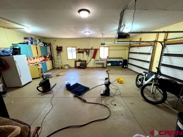 a room with gym equipment and lots of equipment