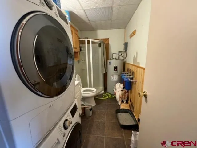 a bed room with a bed and a chandelier