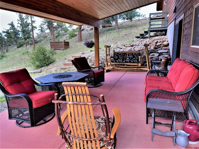 a outdoor space with patio furniture and a potted plant