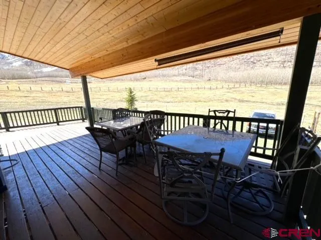 a view of a balcony with furniture