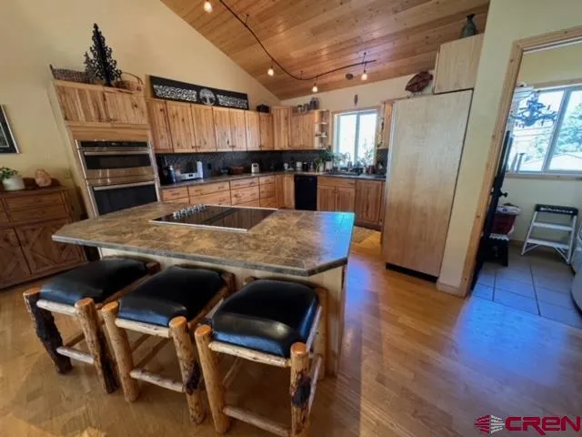 a view of kitchen with cabinets and wooden floor