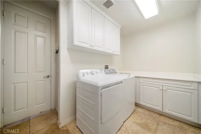 a view of a livingroom with a ceiling fan and window