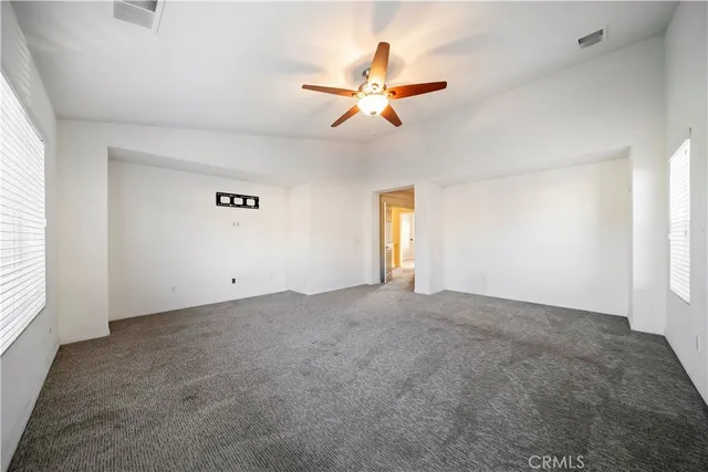 a spacious bathroom with a tub sink and mirror