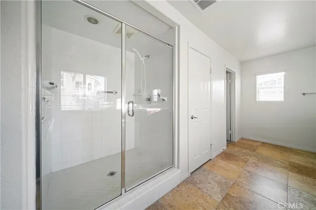 a view of a hallway with windows