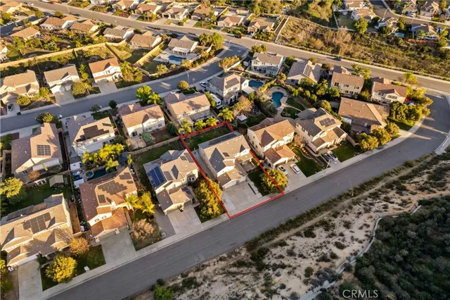 a view of a backyard with swimming pool