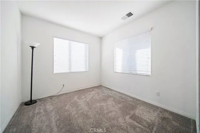 an aerial view of residential houses with city view