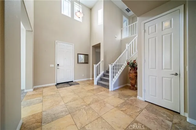 a kitchen with a refrigerator and a sink
