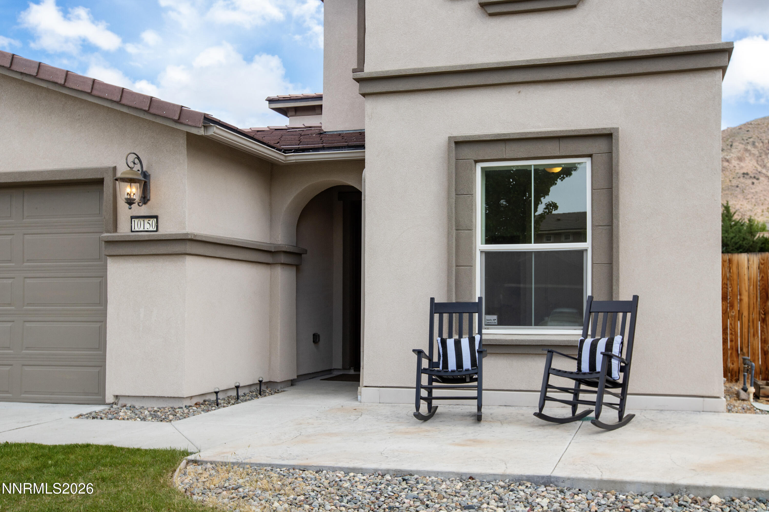 10150 Barrel Racer Drive Reno, NV 89521 - Photo 62 of 64 a backyard of a house with table and chairs