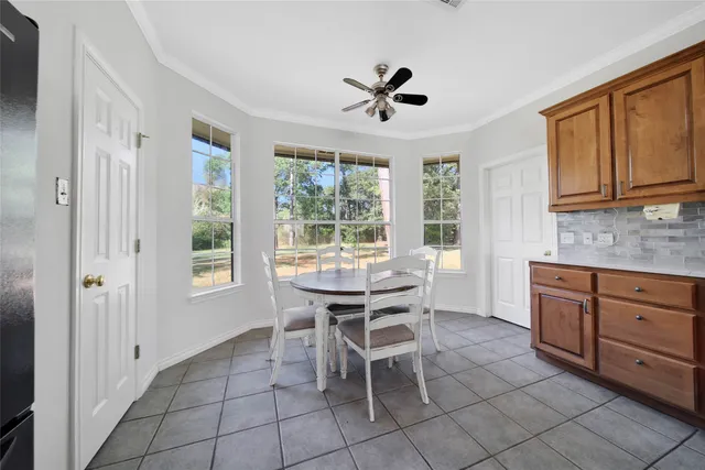 a kitchen with a sink a counter top space and stainless steel appliances