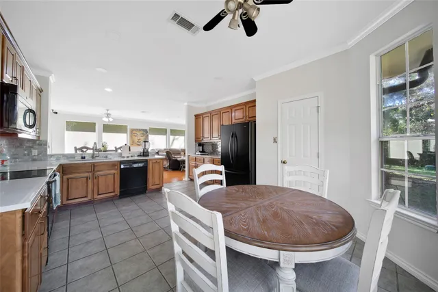 a bedroom with a bed dresser and a window