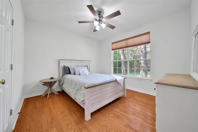 a bed room with a bed and a window