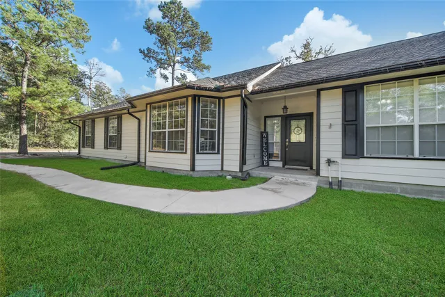 a view of a workspace with furniture and cabinet