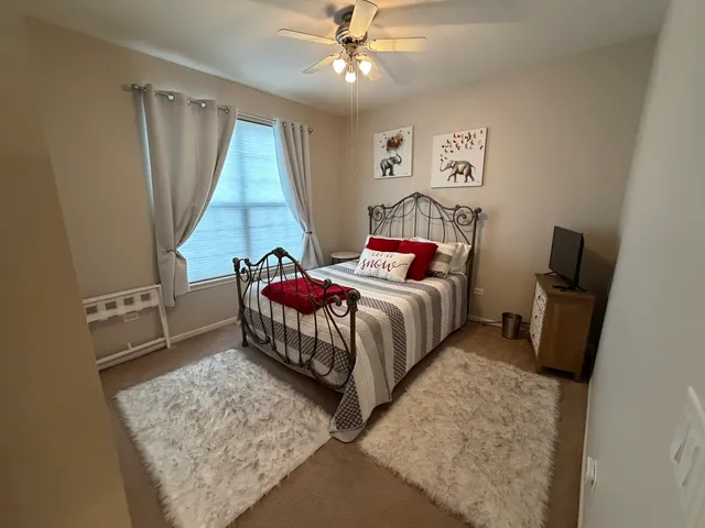 a bed room with a bed and a couch