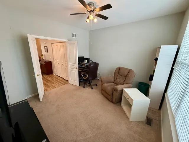 a living room with furniture and a window