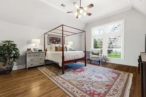 a bedroom with furniture and a window