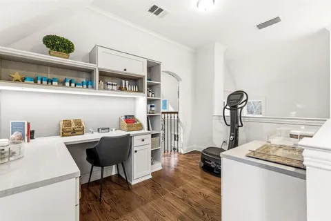 a work room with furniture and a table