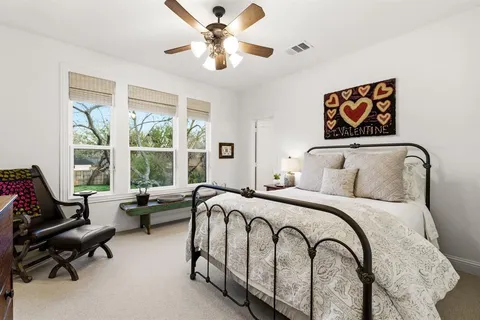 a bedroom with a bed and furniture