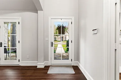 a view of entryway with wooden floor
